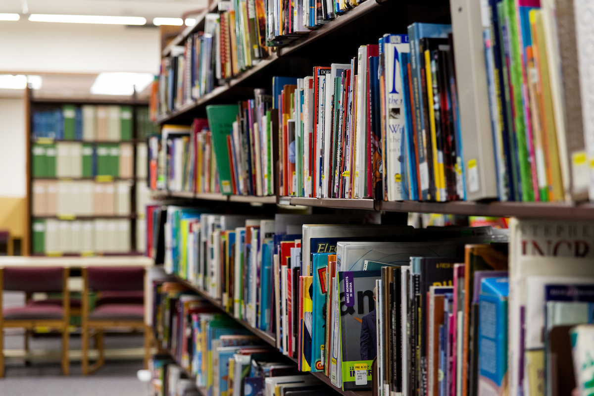 Rows of books on a shelf in a library